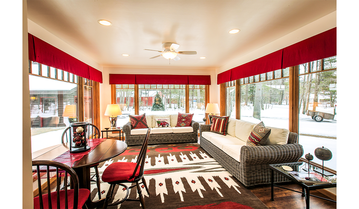 Enjoy the sunshine, snowflakes or fall colors in the cozy sunroom.