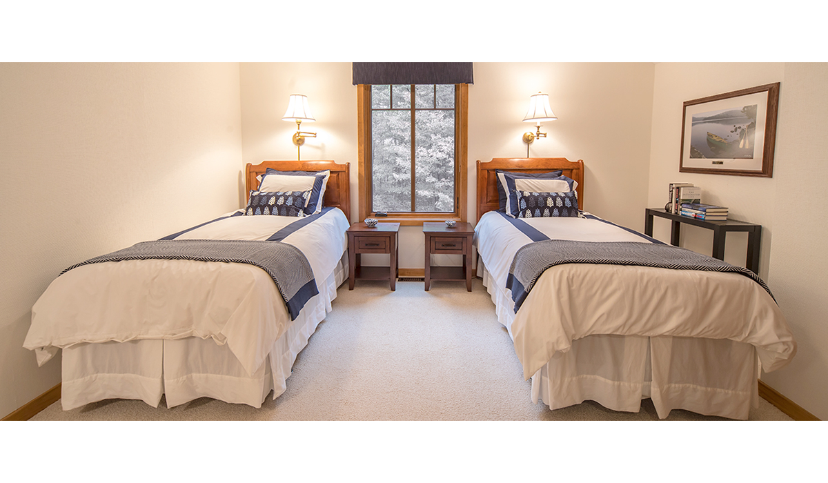 Clean and inviting second bedroom with twin beds for the kids.