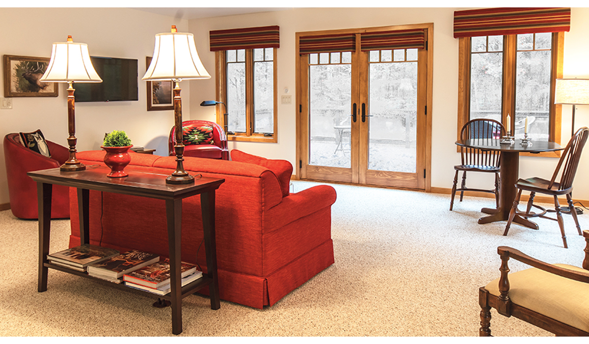 Living room faces the patio with views of the Northwoods.