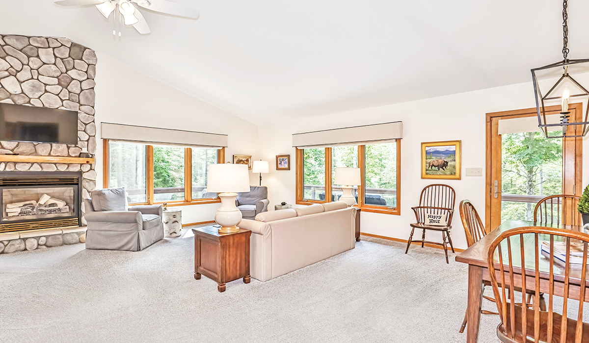 Large living room with fireplace provides the perfect gathering area.