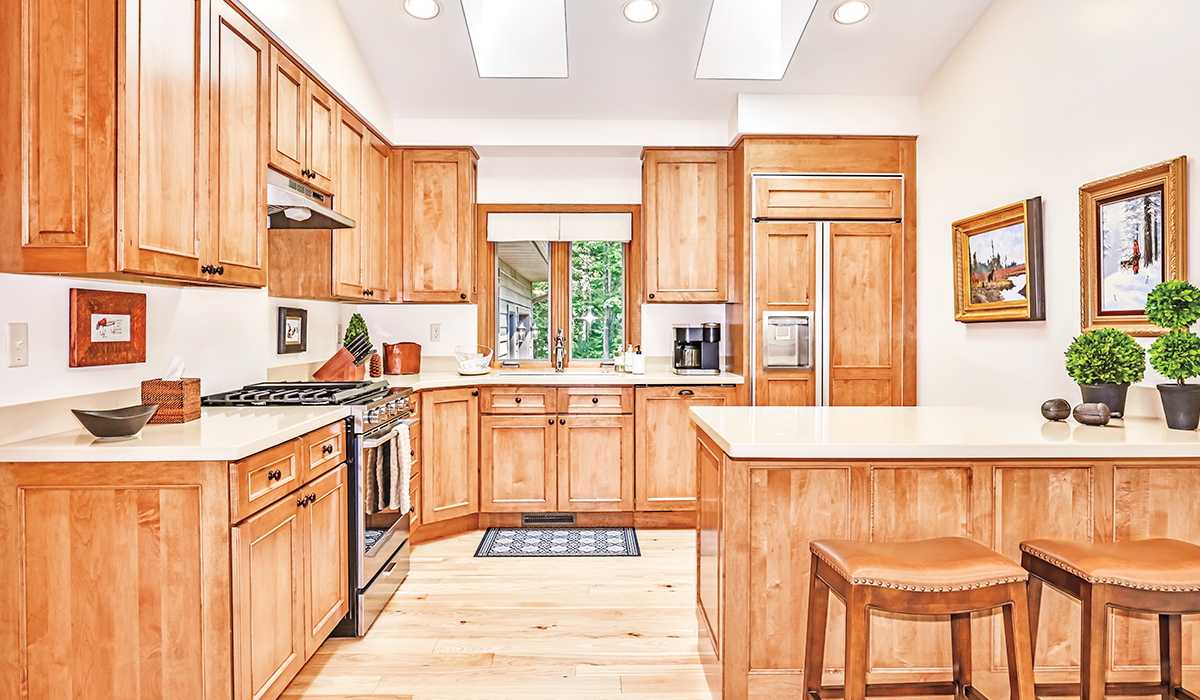 Bright, fully equipped kitchen with breakfast bar.