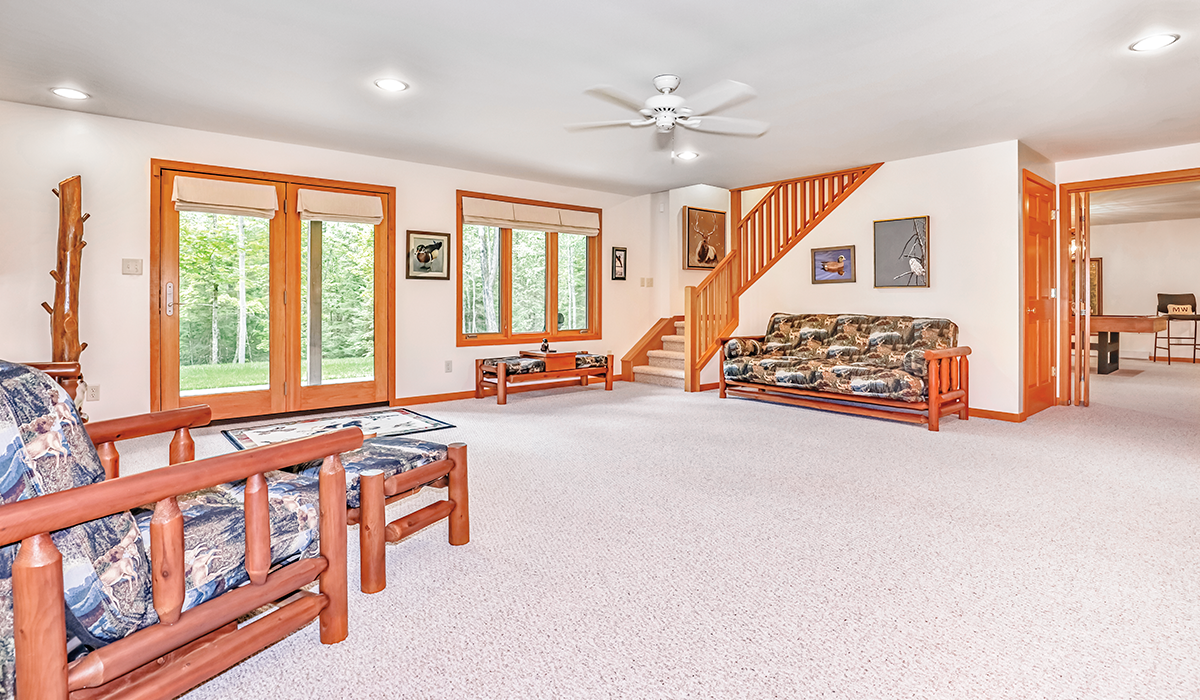 Finished, walkout basement with pool table, wet bar and sleeping area.